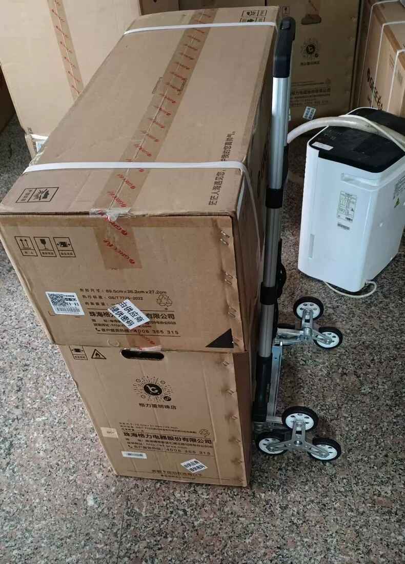 this is an image showing the ALL TERRAIN MULTIFUNCTIONAL STAIRS CLIMBING CAR-solution-hub.com.ng carrying large loads that are heavy